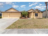 Charming one story home with a three car garage and well manicured lawn with beautiful landscaping at 2739 Village Pine Ter, Orlando, FL 32833