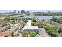A panoramic view of the property, showcasing the building's position near the tranquil lake and the city skyline at 320 Lakeview St # 222, Orlando, FL 32804