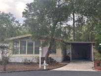 Charming home with a carport and mature trees in a well-kept neighborhood at 551 Pine Needle Ct, Lake Mary, FL 32746