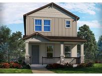 Charming two-story home featuring a welcoming front porch and beautifully landscaped front yard at 11941 Bracco St, Winter Garden, FL 34787