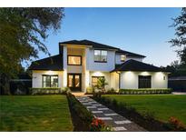 Stunning two-story home boasts a meticulously landscaped yard and elegant modern architectural details at 1840 Bryan Ave, Winter Park, FL 32789