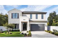 Beautiful two-story home featuring a modern design with brick and stucco accents at 2612 Musselwhite Ave, Orlando, FL 32804