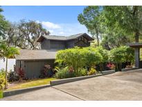 Unique home featuring modern architecture complemented by a lush garden landscape at 613 Lake Ave, Altamonte Springs, FL 32701