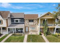 Charming townhouse featuring unique architectural details and well-maintained landscaping at 8830 Sw 98Th Pl # M, Ocala, FL 34481