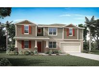 Inviting two-story home featuring a two-car garage, charming shutters, and a well-manicured lawn at 9256 Sea Pine Ave, Orlando, FL 32832