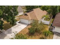 Charming home with a well-maintained lawn and a two-car garage at 11113 Sylvan Pond Cir, Orlando, FL 32825