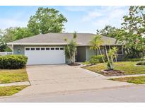 Charming single-story home with an attached two-car garage and well-manicured landscaping at 105 Dublin Dr, Lake Mary, FL 32746