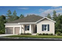 Charming one-story home featuring a beige exterior, attached garage, and well-manicured lawn at 12869 Harvest Rain Ave, Winter Garden, FL 34787