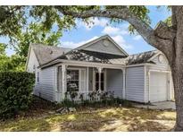 Charming single-story home featuring a cozy front porch, well-manicured lawn, and attached one car garage at 1527 Braewick St, Winter Springs, FL 32708