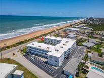 Aerial view of a beachfront condo featuring updated roofing, and proximity to the beach, and on-site parking at 1926 Ocean Shore Blvd # 3120, Ormond Beach, FL 32176