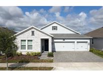 Charming single-Gathering home with a 3-car garage and beautifully paved driveway at 2926 Wordsmith Rd, Kissimmee, FL 34746