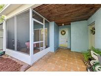 Charming front porch with tile flooring and a screened-in area perfect for relaxing outdoors at 702 Glasgow Ct, Winter Springs, FL 32708