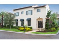 Stunning two-story home featuring elegant architecture, manicured landscaping, and a welcoming entrance at 9730 Lounsberry Cir, Golden Oak, FL 32836