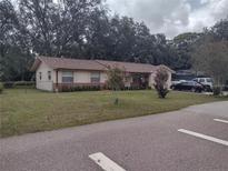 Charming single story home with mature landscaping and neutral paint scheme at 123 N High St, Lake Mary, FL 32746