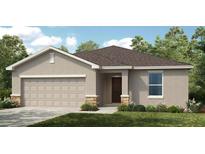 Charming single-story home with a two-car garage and stone accents for added curb appeal at 4760 Yellow Elder Way, Kissimmee, FL 34758
