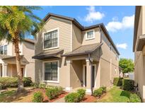 Charming two-story home with manicured landscaping and a welcoming front entrance at 7349 Ella Ln, Windermere, FL 34786