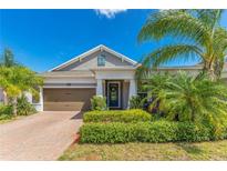 Charming single-story home with lush landscaping and a welcoming brick-paved driveway at 2127 Bay Line Rd, Oakland, FL 34787