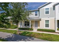 Charming townhouse with a quaint front patio, perfect for enjoying the outdoors at 2203 Gopher Tortoise Ter, Oakland, FL 34787