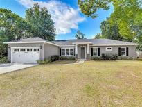 Charming single-story home featuring a two-car garage, neutral paint, and well-maintained landscaping at 39 Lake Dr, Debary, FL 32713
