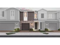 Charming townhome showcases modern brick accents, a private garage, and inviting curb appeal at 540 Southern Edge Way, Sanford, FL 32771