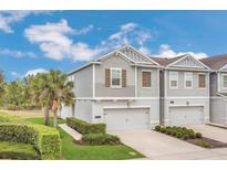 Charming two-story townhome with well-maintained landscaping and attached one car garage at 12307 Turtle Grass Dr, Orlando, FL 32824