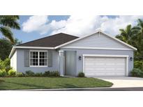 Charming one-story home with a two car garage, well-maintained lawn, and beautiful landscaping at 1247 Blue Daze Ln, Eustis, FL 32726