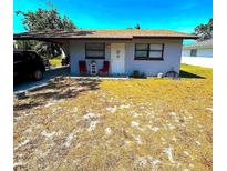 Cozy single-story home featuring a carport, a simple front yard, and a welcoming entrance at 3015 Avenue I Nw, Winter Haven, FL 33881
