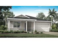 Charming single-story home featuring a stone-accented facade, covered porch, and attached two-car garage at 12954 Promise Pl, Orlando, FL 32832