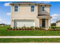 Charming two-story home with a well-maintained lawn and attached two-car garage at 3617 Fort Mellon Ln, Sanford, FL 32773