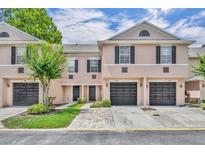 Charming townhome with a well-maintained lawn and a one-car garage in a desirable neighborhood at 5102 Monticello Heights Ln, Oviedo, FL 32765