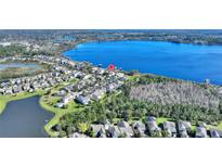 Breathtaking aerial view of lakeside community with waterfront homes and private boat docks at 14906 Speer Lake Dr, Winter Garden, FL 34787