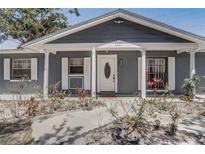 Charming home featuring an eye-catching facade, bright shutters and trim, and inviting front yard space at 4201 Chantelle Rd, Orlando, FL 32808