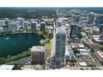 An amazing aerial view of downtown Orlando, a lake and the city skyline at 150 E Robinson St # 717, Orlando, FL 32801