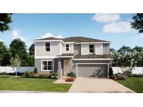 Charming two-story home boasts a modern design, manicured lawn, and a two-car garage, perfect for comfortable living at 1804 Columbus Path, St Cloud, FL 34771