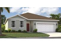 Charming single-story home with a well-manicured lawn, two-car garage, and welcoming front entrance at 3588 Dahlia Dr, Haines City, FL 33844
