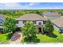 Inviting home with a well manicured lawn and lovely stone accented entry at 408 Egret Place Dr, Winter Garden, FL 34787