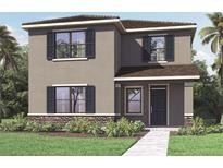 Charming two-story home with stone accents, dark shutters, and tropical landscaping in a sunny setting at 5217 Marshelder St, Apopka, FL 32712