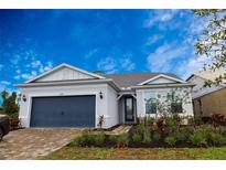 Charming one-story home featuring a two-car garage and lush landscaping at 8105 Fenton St, Orlando, FL 32836