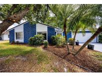 Charming single-story home with well-maintained landscaping and mature trees at 10108 Matchlock Dr, Orlando, FL 32821