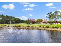 Expansive property featuring a main house, guest house, horse barn, pond with fountain and white fencing at 240 Spring Forest Dr, New Smyrna Beach, FL 32168