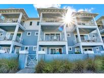 Beautiful light-blue exterior with white trim and multiple balconies offering stunning views at 7 Marden Dr, Ormond Beach, FL 32176