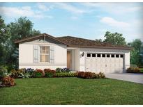 Charming one-story home with a two-car garage and beautifully landscaped front yard at 1100 Griffon Ave, Lake Alfred, FL 33850