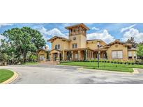 A beautiful exterior view shows the building's unique architectural details, landscaped surroundings, and inviting entrance at 114 Vista Verdi Cir # 136, Lake Mary, FL 32746