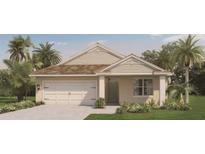 Charming one-story home featuring a two-car garage, neutral exterior, and well-manicured landscaping at 211 Taylor Groves Dr, Lake Wales, FL 33853