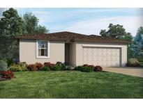 Charming single-story home featuring a well-manicured lawn and colorful landscaping at 2381 White Tail St, Davenport, FL 33837