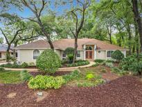Exterior view of a home with mature trees at 1869 Eagles Rest Dr, Apopka, FL 32712