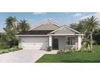 Charming single-story home featuring a two-car garage and a well-manicured lawn with tropical landscaping at 203 Taylor Groves Dr, Lake Wales, FL 33853
