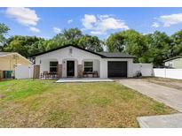Charming single-story home featuring a well-maintained lawn and inviting front porch area at 376 Orange Ave, Longwood, FL 32750