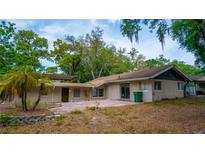 Exterior view of a home with a brick patio and lush greenery at 530 Webster St, Lake Mary, FL 32746