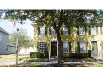 Charming townhome with neutral exterior, black shutters, well-maintained landscaping, and inviting front door at 6258 Westcott Cove Blvd, Orlando, FL 32829